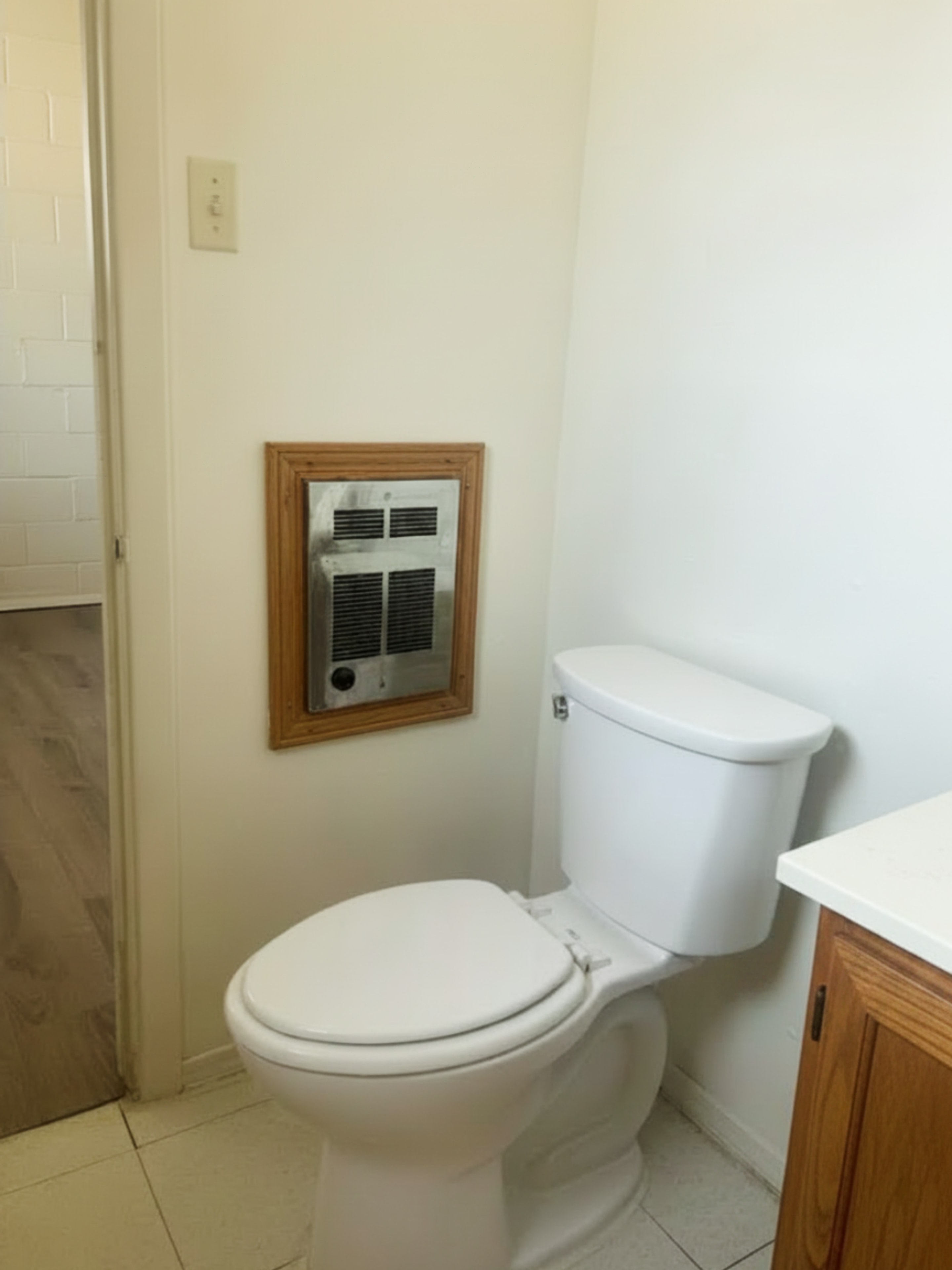 705 Bursum bathroom with toilet and wall heater