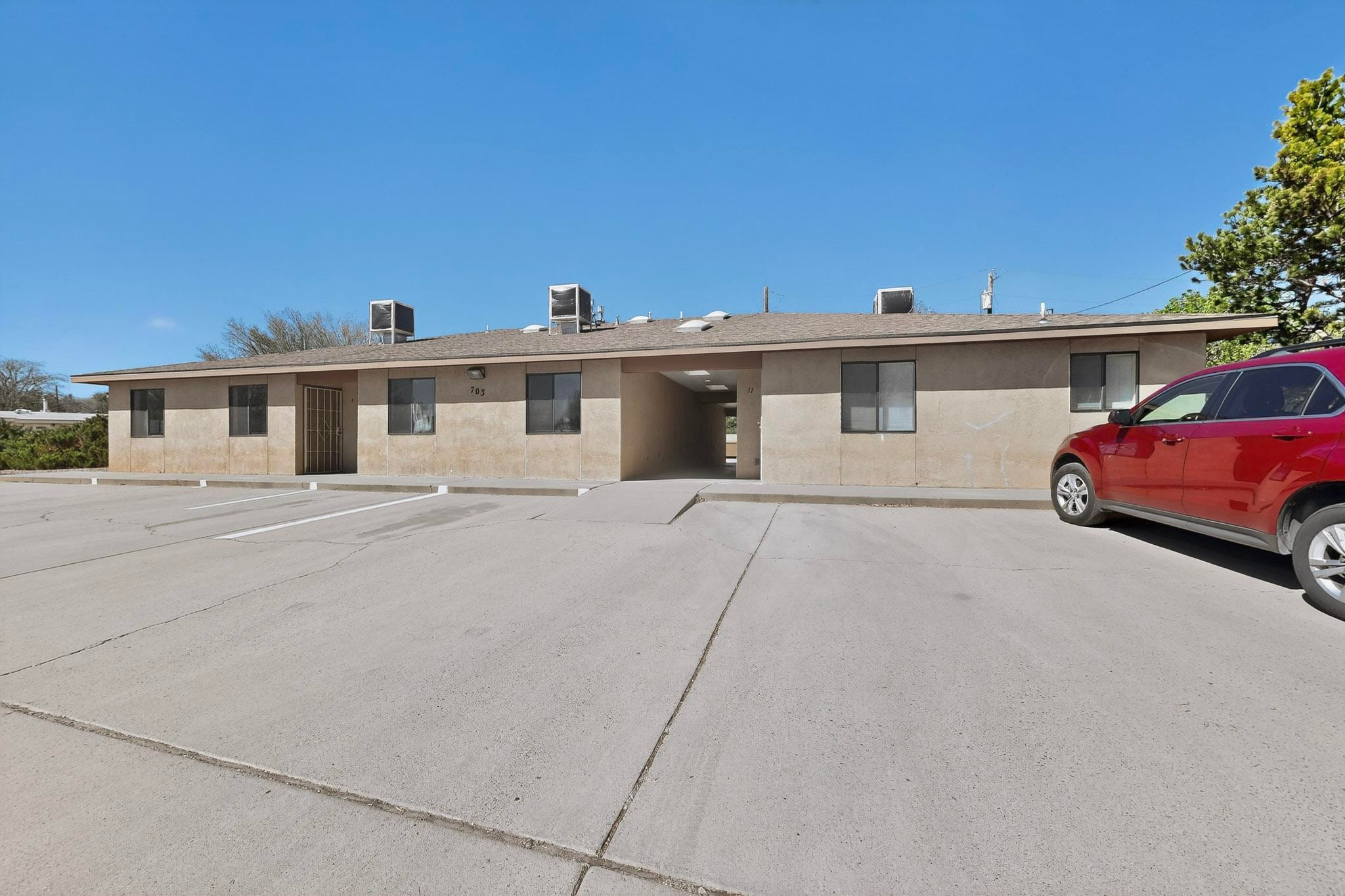 705 Bursum front building exterior showing unit entrances and parking